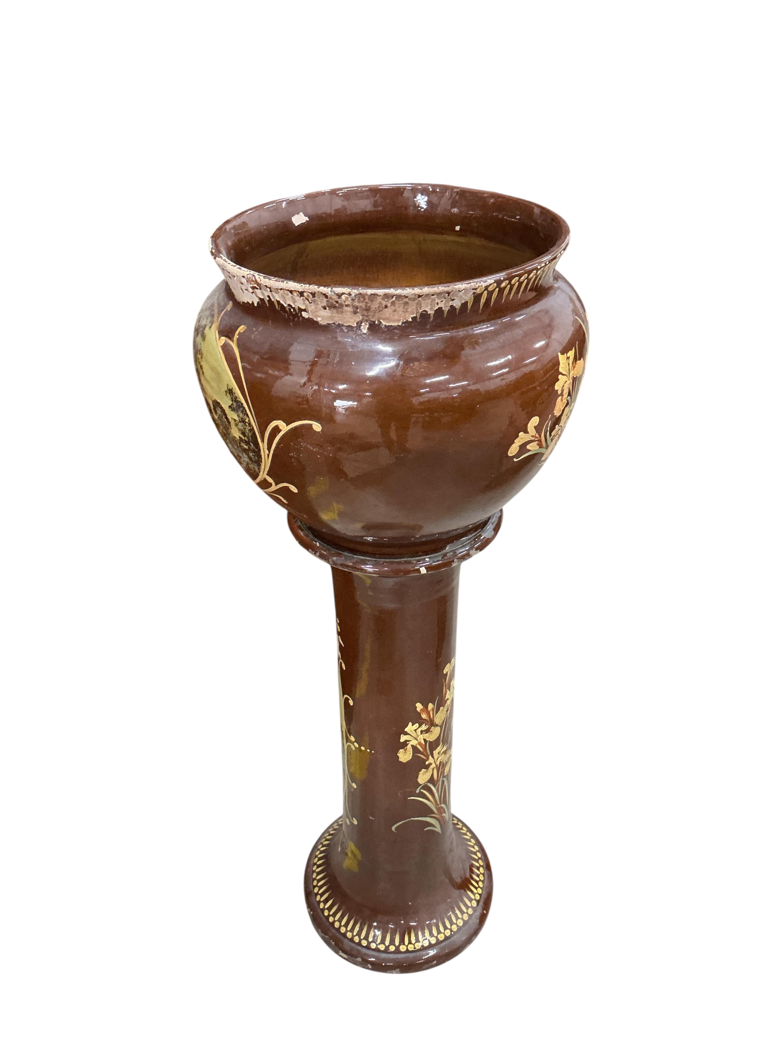 A Victorian glazed earthenware jardiniere on stand, diameter 44cm, height 108cm